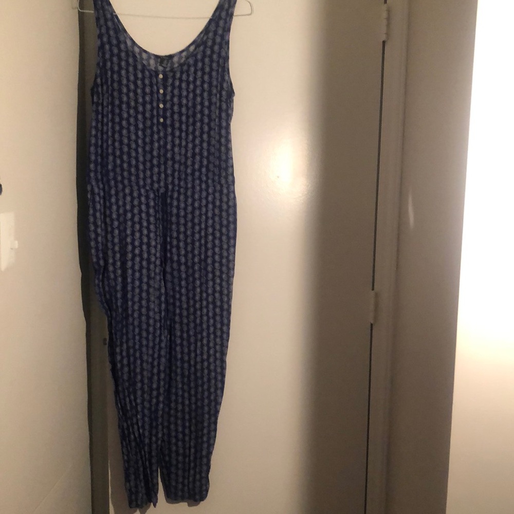 Navy Blue romper with white accents designs, full leg length, buttons on front